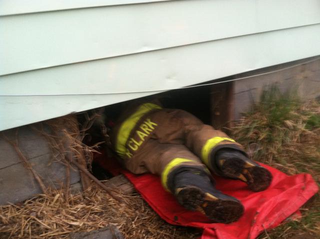 FF Clark entering crawl space